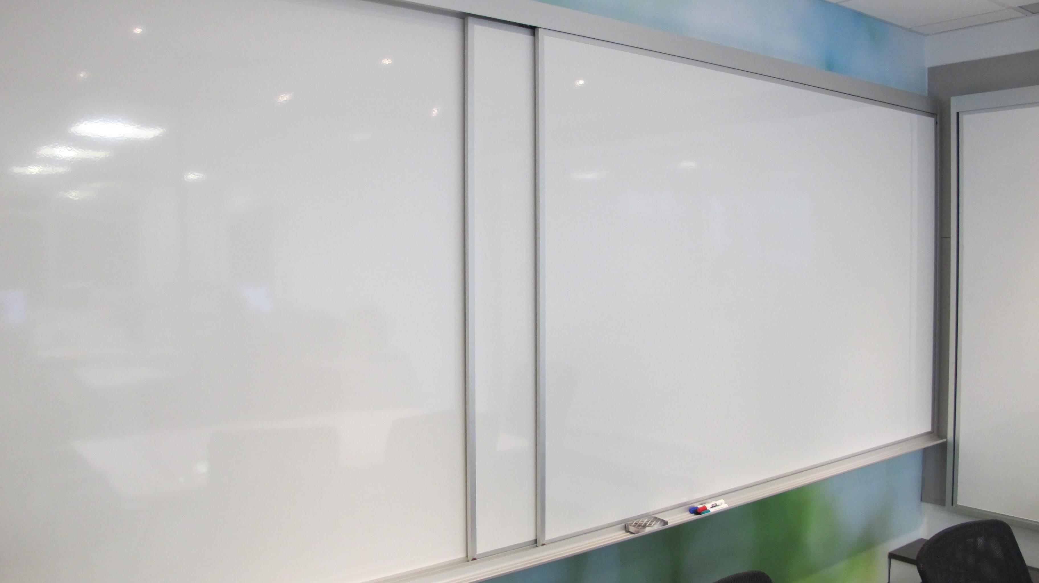 Horizontal sliding board with a dry-erase writing surface